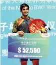  ??  ?? K. Srikanth of India celebrates during the awards ceremony after beating Lin Dan of China to win the men’s singles title at the Badminton China Open in Fuzhou, China’s Fujian province on November 16, 2014. - AFP photo