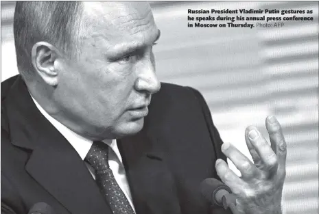  ??  ?? Russian President Vladimir Putin gestures as he speaks during his annual press conference in Moscow on Thursday.