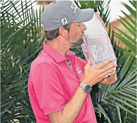  ??  ?? In the pink: Webb Simpson celebrates winning the Players Championsh­ip