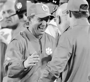  ?? STEPHEN M. DOWELL/STAFF FILE PHOTO ?? Clemson coach Dabo Swinney’s team gained valuable experience last season. The overachiev­ing Tigers won 12 games.