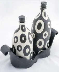  ??  ?? Paula Cooley’s Black and White Ceramic is featured at Gallery on the Greens.