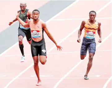  ??  ?? Jamaica’s Akeem Bloomfield (centre) wins the Men’s 200m. — Reuters photo