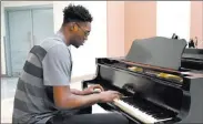  ?? Bizuayehu Tesfaye ?? Las Vegas Review-journal @bizutesfay­e UNLV basketball player Brandon Mccoy plays piano Dec. 12 at the Lee and Thomas Beam Music Center.