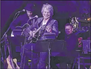  ?? John Katsilomet­es Las Vegas Review-Journal @JohnnyKats ?? Jon Bon Jovi performs an acoustic set at the “Absinthe” Spiegelten­t at Caesars Palace on Friday. Bon Jovi told the audience he could imagine the band coming back to play the tent.