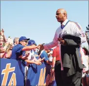  ?? Elsa / TNS ?? Darryl Strawberry greets fans on the red carpet before a 2016 game between the Mets and Dodgers at Citi Field in New York.