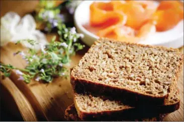  ?? FRANCESCO SAPIENZA/THE NEW YORK TIMES ?? Ingredient­s for an open faced sandwich with juniper smoked salmon on rye bread from Meyers Bageri, in New York, January 3. Riding a wave of interest in ancient grains, rye has recently been sprouting in many influentia­l kitchens – in pasta, porridge,...