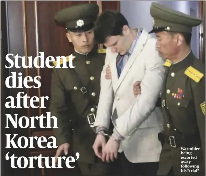  ?? PHOTO: AP ?? Warmbier being escorted away following his “trial”