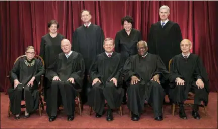  ?? ASSOCIATED PRESS ?? In this June 1, 2017, file photo, the justices of the U.S. Supreme Court gather for an official group portrait to include new Associate Justice Neil Gorsuch, top row, far right at the Supreme Court Building in Washington. Seated, from left are, Associate Justice Ruth Bader Ginsburg, Associate Justice Anthony M. Kennedy, Chief Justice John Roberts, Associate Justice Clarence Thomas, and Associate Justice Stephen Breyer. Standing, from left are, Associate Justice Elena Kagan, Associate Justice Samuel Alito Jr., Associate Justice Sonia Sotomayor, and Associate Justice Neil Gorsuch. The 81-year-old Kennedy said Tuesday that he is retiring after more than 30 years on the court.