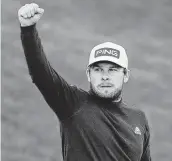  ?? Sam Greenwood / Getty Images ?? Tyrrell Hatton of England reacts to his birdie on the 18th green during the third round of the Arnold Palmer Invitation­al at Orlando, Fla.