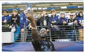  ?? COURTESY ?? Former Baltimore Ravens running back Alex Collins takes a selfie with fans before the wild card playoff game against the Los Angeles Chargers in 2019 in Baltimore. Collins died Sunday after a motorcycle crash in Lauderdale Lakes.