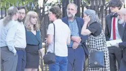  ??  ?? Devastated relations of Michael and Marjorie Cawdery leave Belfast Crown Court after Thomas McEntee was jailed for brutal killing of the pensioners