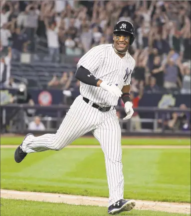  ?? Julie Jacobson / Associated Press ?? Miguel Andujar smiles after driving in the winning run with a single in the ninth inning against the Indians on Friday night.