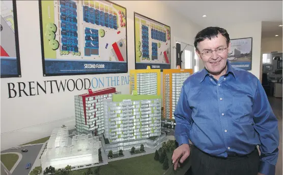  ?? WIL ANDRUSCHAK/ FOR CALGARY HERALD ?? Brentwood on the Park purchaser Jackson Chaves examines a project model at the sales centre. The condos will be open to move-ins in early 2016.