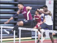  ?? Arnold Gold / Hearst Connecticu­t Media ?? Sacred Heart’s Edward Williams, Jr., left runs to a first-place finish in the 55 meter hurdles.