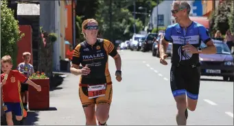  ??  ?? Leanne McCarthy and John O’Sullivan, close to the finishing line in The Hardman Sprint Triathlon