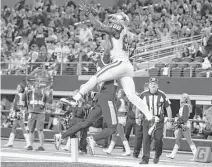  ?? Wesley Hitt / Getty Images ?? Dallas wide receiver Dez Bryant goes up and over Washington’s Bashaud Breeland to haul in a 13-yard touchdown pass in the fourth quarter. It was the 72nd of his Cowboys career — one more than Hall of Famer Bob Hayes.