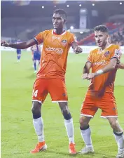  ?? — ISL ?? FC Goa’s goal scorers Lenney Rodrigues (left) and Ferran Corominas break into a dance after scoring their second goal against Mumbai City at half time.