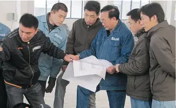  ??  ?? Scientist Shao Zheru (third right) leads his team in the developmen­t of waste-to-energy equipment