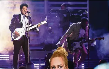  ?? — AFP ?? Bruno Mars channels Prince in his performanc­e.