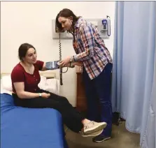  ?? PHOTOS BY ALAA HABHAB WWT SENIOR AND JILLIAN KAFERLE, WWT SENIOR ?? Isabella Popp takes Ashlyn Cumper’s blood pressure, which is a vital skill for CNA’s to master.