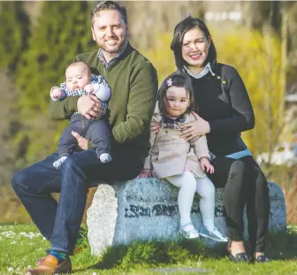  ?? ARLEN REDEKOP ?? Liberal leadership contender Gavin Dew, seen with his wife Erin Shum and kids Abby, 3, and Evan, 4 months, wants the party take a stronger stance on social issues, housing affordabil­ity and climate change.