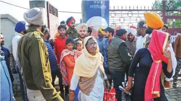  ?? PTI ?? People come out of the complex owned by the Nirankari sect, where two men on a motorcycle threw a grenade during a religious congregati­on, in Adliwal village near Amritsar yesterday.