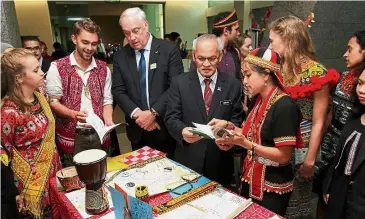  ??  ?? Bridging
cultures: Dr Coffman (third left) and Aminudin (fourth left) visiting the Sabah Fulbright English Teaching Assistants’ booth in Putrajaya.