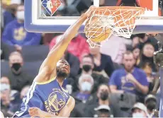  ?? — AFP photos ?? Andrew Wiggins of the Golden State Warriors dunks the ball in the first half against Timberwolv­es at Chase Center in San Francisco.