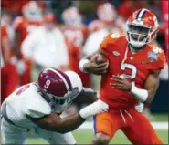  ?? BUTCH DILL — THE ASSOCIATED PRESS FILE ?? In this Monday file photo, Clemson quarterbac­k Kelly Bryant (2) is sacked by Alabama defensive lineman Da’Shawn Hand (9) in the second half of the Sugar Bowl semi-final playoff game for the NCAA college football national championsh­ip, in New Orleans.