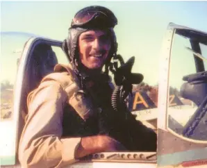  ??  ?? Lt. Jacques Young in the cockpit of “Jumpin’ Jacques,” Laoag Airfield, Luzon, Philippine­s, April 1945. Note the Mustangs in the background with tail letters “A” and “Z.” (Robert Renner via Kurt Young)