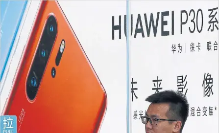  ?? ANDY WONG THE ASSOCIATED PRESS ?? Huawei said revenue rose 23 per cent to about US$58.3 billion from a year earlier, marking an accelerati­on in growth.