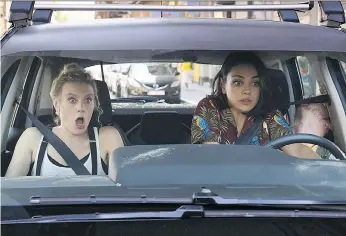  ?? LIONSGATE ?? Kate Mckinnon, left, and Mila Kunis play best friends on the run from profession­al killers in the new movie The Spy Who Dumped Me, which hits theatres Friday.