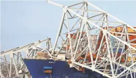  ?? JULIA NIKHINSON/REUTERS ?? Officials said at a news conference that the shipping vessel Dali was leaving the Port of Baltimore when it struck the Francis Scott Key Bridge early Tuesday.