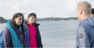  ?? CTV ?? Shahla Kara, left, and Nabeela Barday learn from host Jon Montgomery that they’re the last team to arrive and the first team to be eliminated on the second season of The Amazing Race Canada.