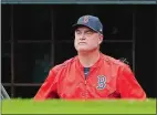  ?? CHARLES KRUPA/AP PHOTO ?? Red Sox manager John Farrell looks on from the dugout during Sunday’s ALDS Game 3 against the Astros at Fenway Park.