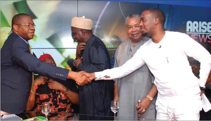  ??  ?? Charles (left) in a handshake with Edu to the admiration of Horsefall, while Nwodo and Yadudu chat on after the debate