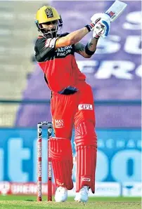  ??  ?? Royal Challenger­s Bangalore captain Virat Kohli notched up his first half-century of IPL 2020 against Rajasthan Royals