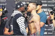  ?? MIKE STOBE / GETTY IMAGES ?? The promotiona­l act between Floyd Mayweather Jr. (left) and Conor McGregor is a tired one, and we’re still more than three weeks from the fight.