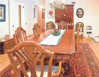  ?? ?? The formal dining room sits right near the home’s entrance and provides plenty of space for entertainm­ent.