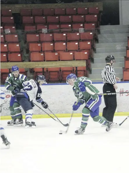  ?? RUSS ULLYOT ?? For Calgary Canucks players like Jordan McConnell, here taking a shot against Canmore, the empty seats at the Max Bell Centre have become a familiar sight.