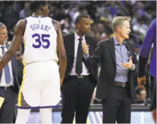  ?? Scott Strazzante / The Chronicle ?? Warriors head coach Steve Kerr disputes a foul call during the first quarter. He later was ejected for arguing another call.