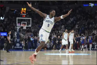  ?? ABBIE PARR — THE ASSOCIATED PRESS ?? Minnesota Timberwolv­es guard Anthony Edwards celebrates after scoring during the second half against the Nuggets on Tuesday in Minneapoli­s.