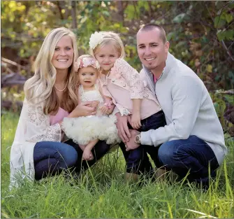  ??  ?? Drs. Josh and Sarah Rowden enjoy spending time with their two daughters.