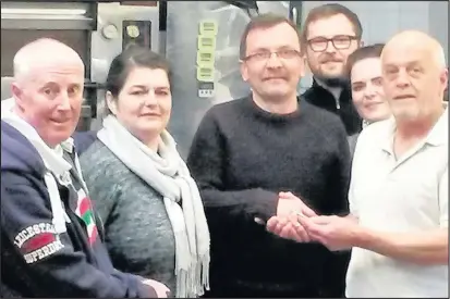  ??  ?? Baking brothers Andy Connor and Mark Connor, right and left, handed the keys to Connor’s Bakery in Hinckley to new owners Slawek, centre, and Zofia Wrobel, who will be running the business with their children Matty and Ola. Below long serving staff...