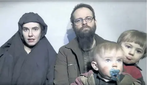  ?? THE ASSOCIATED PRESS FILES ?? Caitlan Coleman talks in the video while her Canadian husband Joshua Boyle holds their two children during their captivity in Afghanista­n.