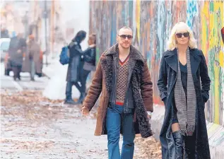  ?? COURTESY OF FOCUS FEATURES ?? James McAvoy and Charlize Theron star in the film “Atomic Blonde.”