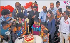  ?? ?? Left: Health Minister Dr Atonio Lalabalavu, back left, during the cake cutting ceremony yesterday. Right: The Sri Sathya Sai Sanjeevani Children’s Hospital’s mascot Loloma the Legend entertains the crowd.
