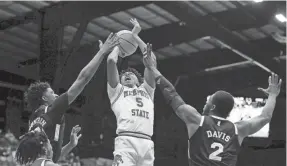  ?? PHOTO COURTESY UNIVERSITY OF NORTH TEXAS ?? Memphis' Boogie Ellis drives toward the basket during the NIT championsh­ip game Sunday against Mississipp­i State.