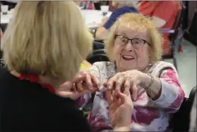  ?? LEAH MCDONALD - ONEIDA DAILY DISPATCH ?? Mary Rose Durfee shows off her painted nails during her 103rd birthday celebratio­n at the Extended Care Facility in Oneida on Friday.