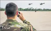 ?? AFP ?? Texas National Guard helicopter­s fly to the Mexico border.